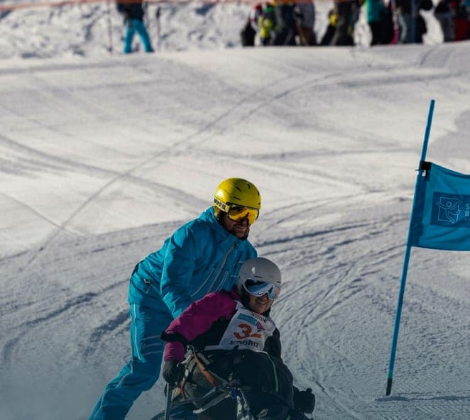 Placeholder: instructor guiding a sit-skier