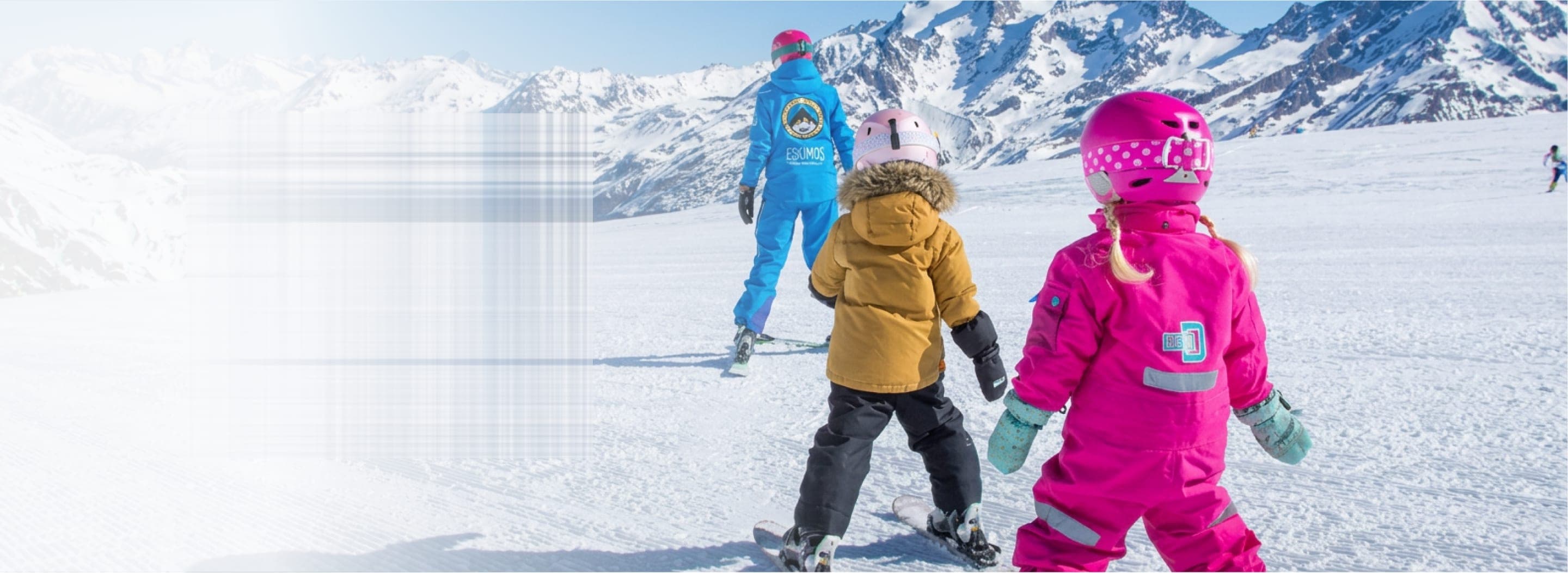 Placeholder: children skiing behind their instructor